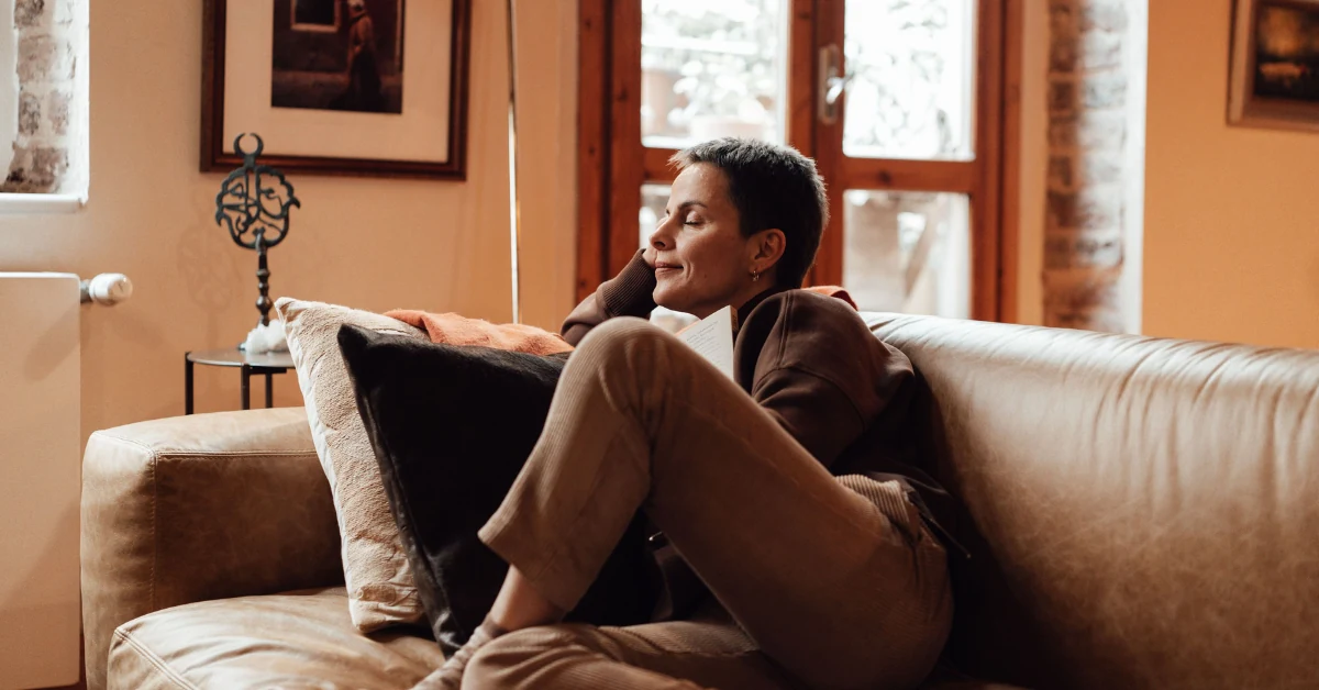 Person experiencing fatigue linked to multiple sclerosis while resting at home