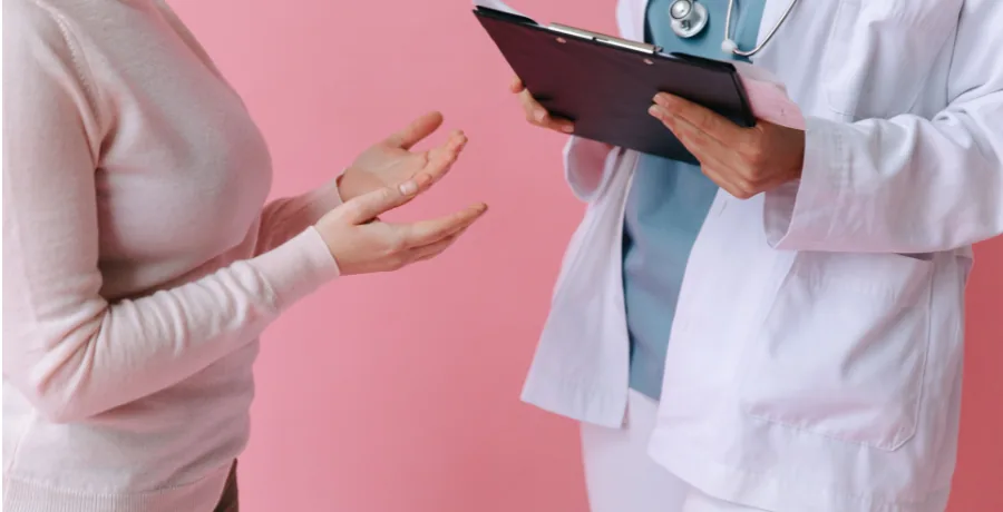 Person having a calm conversation with a clinician in an outpatient setting