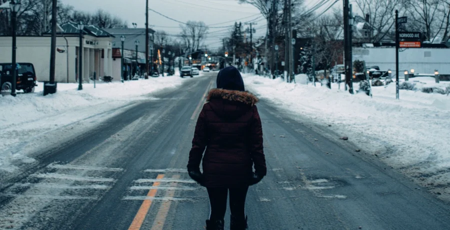 Person on a short morning walk in overcast light, warm coat